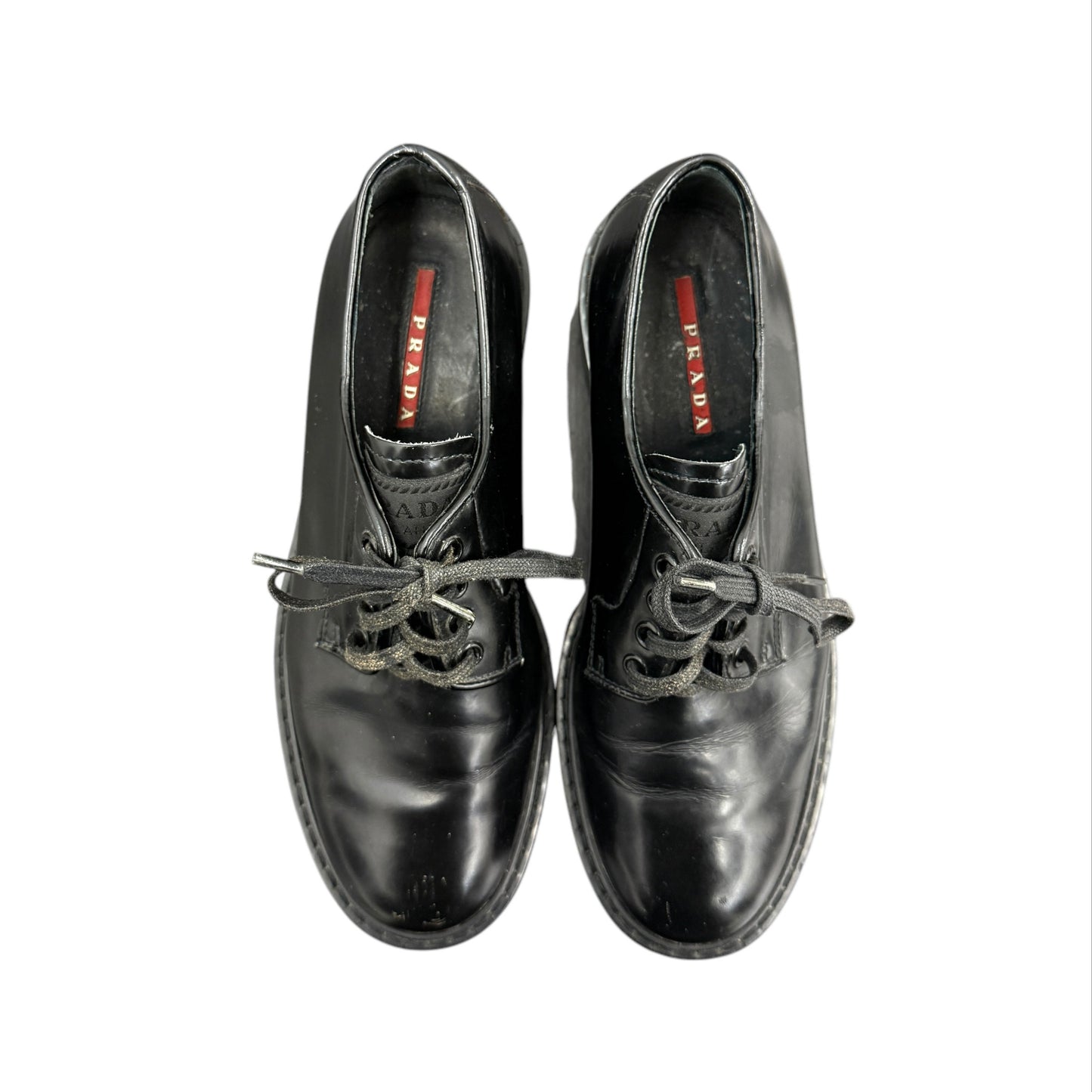 Prada black lace-up loafers