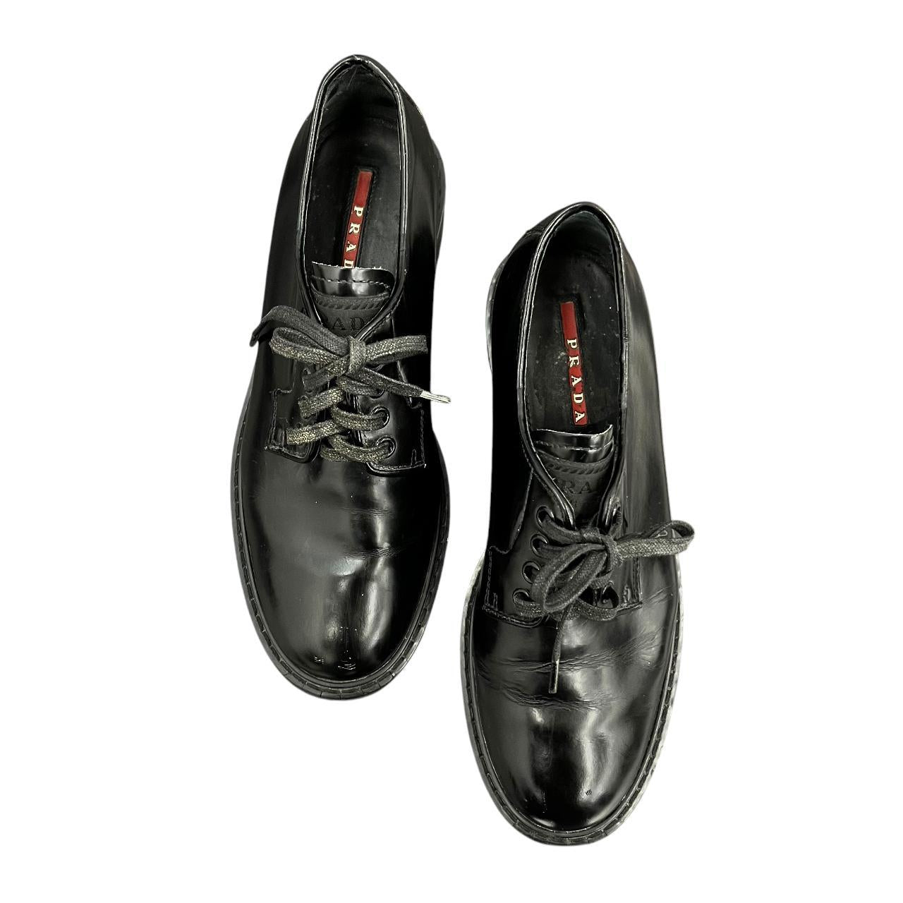 Prada black lace-up loafers
