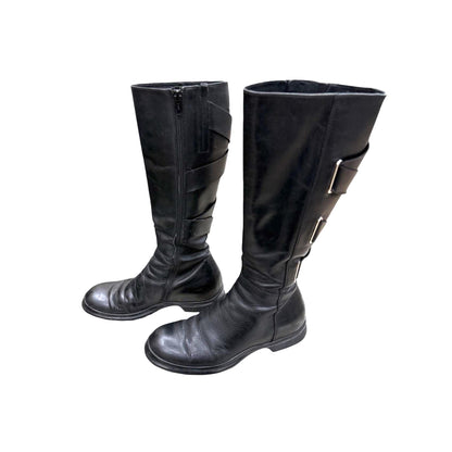 Knee-high leather boots with straps